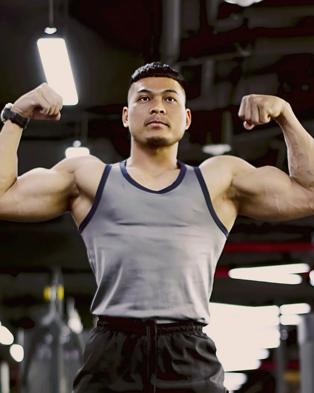 Phen after the transformation, flexing in the gym